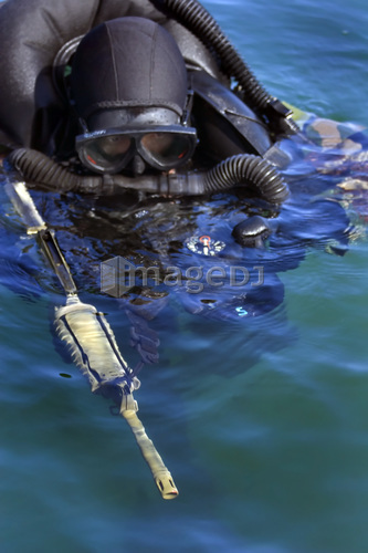 A Navy SEAL combat swimmer.