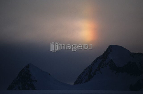 rainbow over ridge on a glacier in the St. Elias mountains