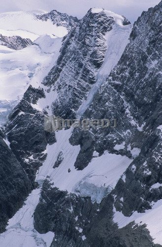 Alpine lake with glacier and mountains surrounding, Lake of the Hanging Glacier, East Kootenays, B.C.