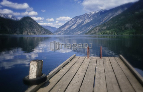 Summer at Anderson Lake, with the old dock in foreground, B.C.