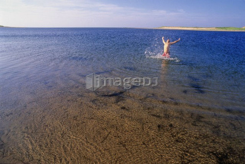 Boy, 12, jumps out of ocean with arms high, PEI