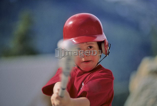 boy, 6, hits baseball with bat