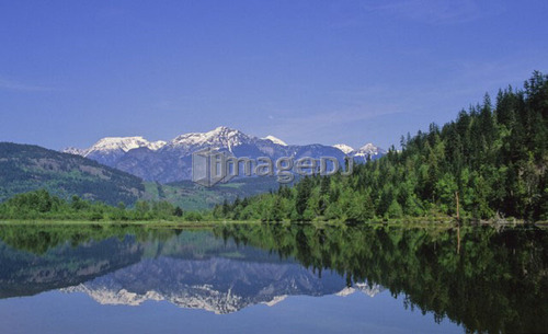 Cayoosh Mountain Range in reflected in One Mile Lake, near Pemberton