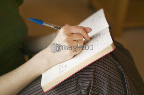 Woman writing in a journal, B.C.