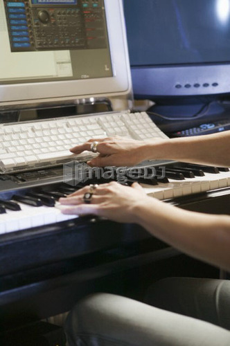 Caucasian woman in recording studio, B.C.