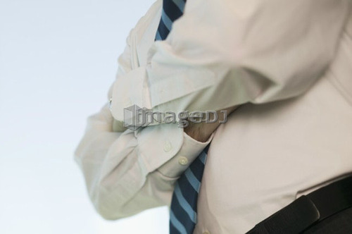 Business man with arms crossed, B.C.