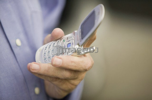 Senior caucasian male and cell phone, B.C.