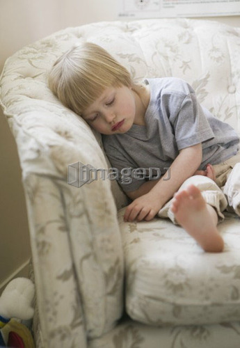 Sad 4 Year Old Girl Resting on a Chair, West Vancouver, B.C.