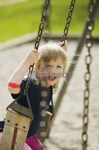 4 Year Old Girl Playing on a Swing, Vancouver, B.C.
