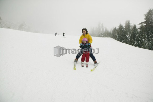 Mom Teaching 4 Year Old Daughter to Ski, Grouse Mountain, North Vancouver, BC Canada