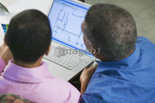 African American couple using a laptop to design a new home or renovation