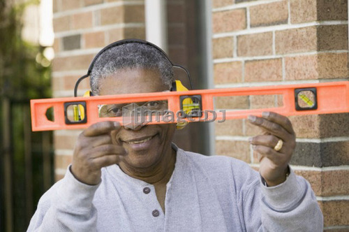 African American man and a construction level, B.C.