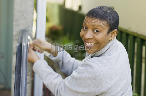 African American woman doing home improvement, B.C.