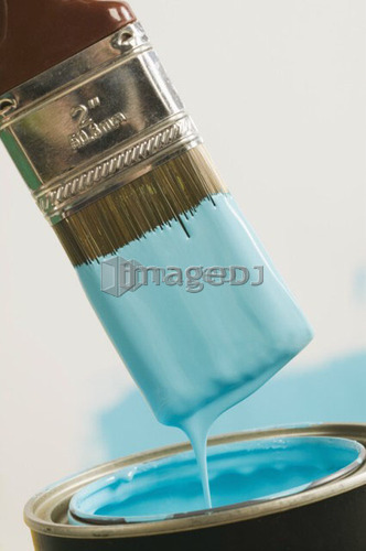 Paint Brush Dipped into Paint Drips off excess