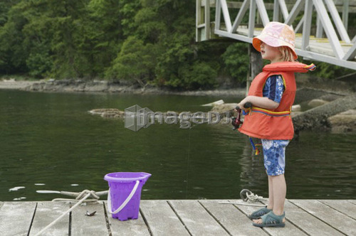 Young Girl Fishing at a Dock, Gambier Island, B.C.
