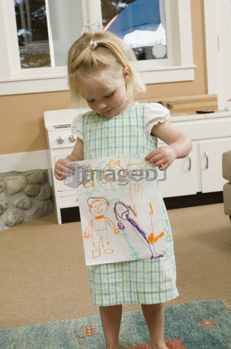 3 year old girl showing her artwork, B.C.