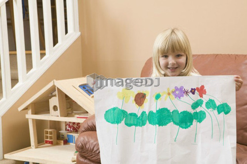 5 year old girl showing off their artwork, B.C.