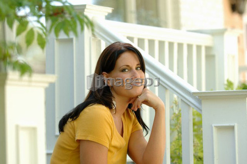 Young woman sitting on steps, Regina, Saskatchewan