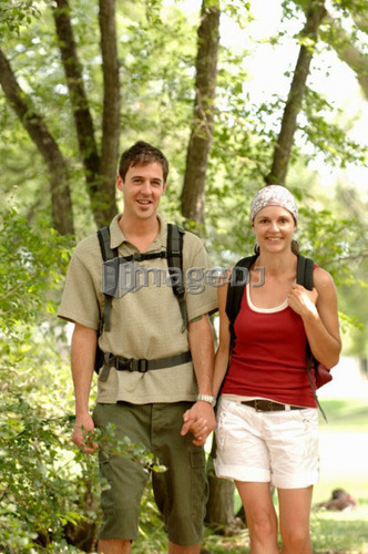 Young couple hiking in woods, Regina, Saskatchewan