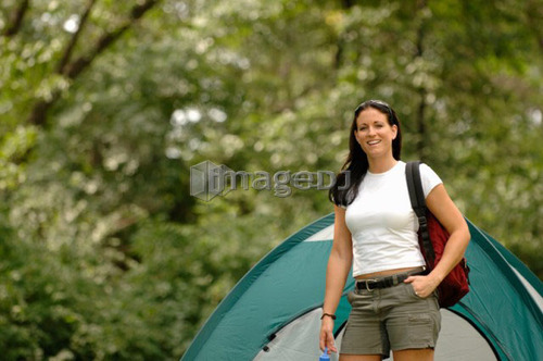 Young woman in front of tent, Regina, Saskatchewan
