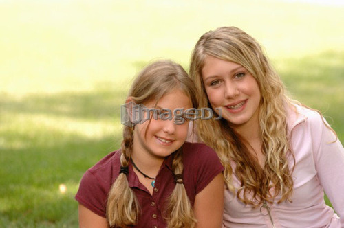 Portrait of young girls on grass, Regina, Saskatchewan