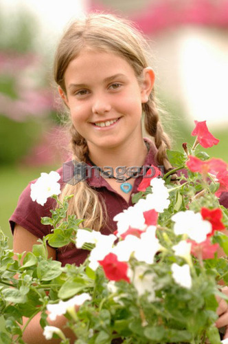 Young girl holding flowers, Regina, Saskatchewan