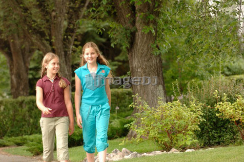 Young girls walking down street, Regina, Saskatchewan