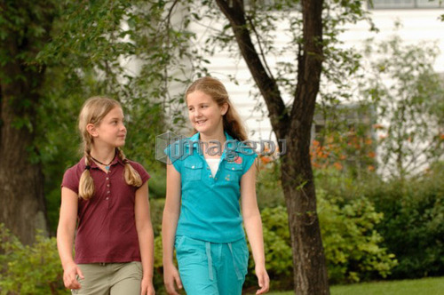 Young girls walking down street, Regina, Saskatchewan