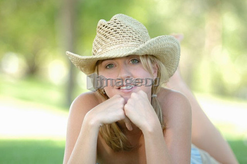 Young blonde female in park with hat, Regina, Saskatchewan