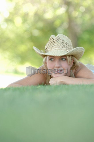 Young blonde female in park with hat, Regina, Saskatchewan