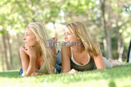 2 young blonde females in park, Regina, Saskatchewan