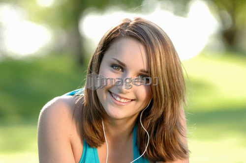 Teenage girl in park w/ipod, Regina, Saskatchewan