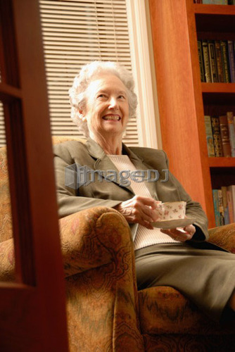 Senior Woman in Library with Tea, Regina, Saskatchewan