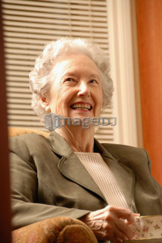 Senior Woman in Library with Tea, Regina, Saskatchewan