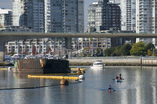 Power boats and paddlers share the Vancouver waterway near False Creek