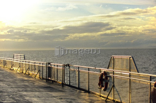 Sunset reflection off the railing on a BC Ferry