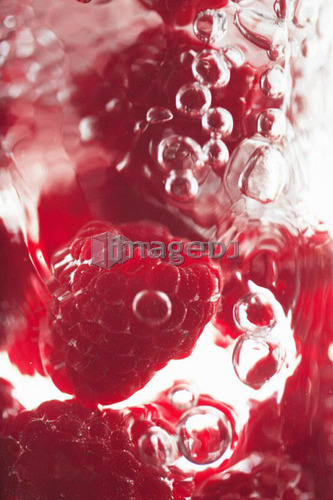 Raspberries floating in water