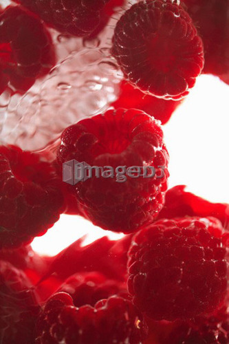 Raspberries floating in water