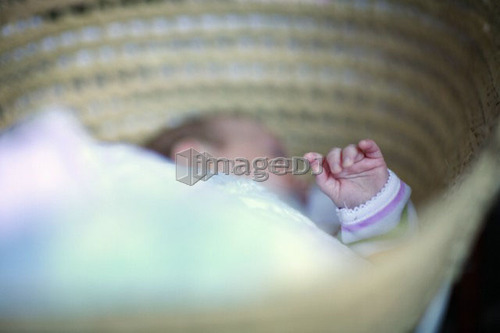 Baby sleeping in basket, Saskatchewan