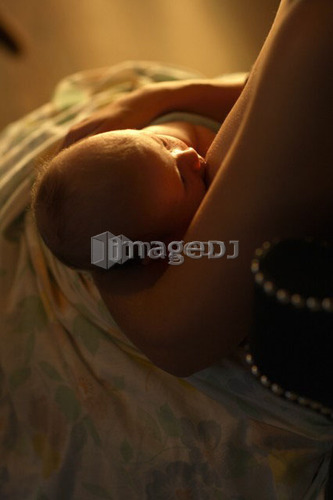 Mother breastfeeding child, Saskatchewan