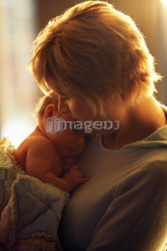 Mother cuddling infant