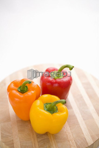 Yellow, orange and red peppers from above