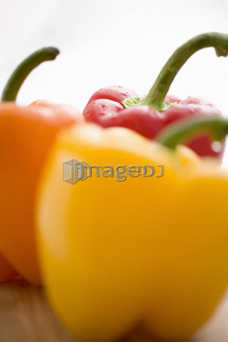 Close-up of yellow, orange and red peppers