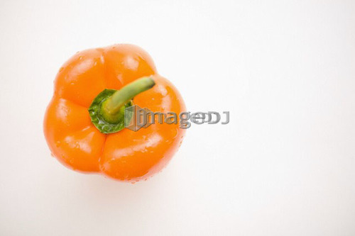 Single orange pepper, from above