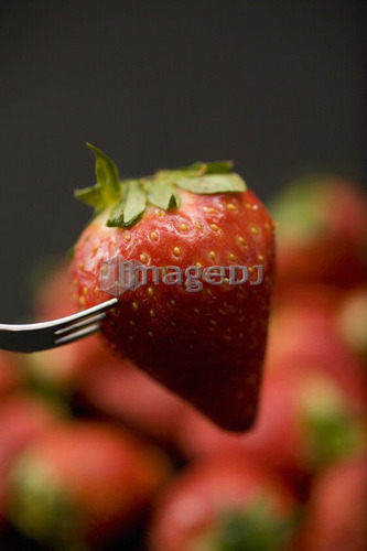 Strawberry on fork