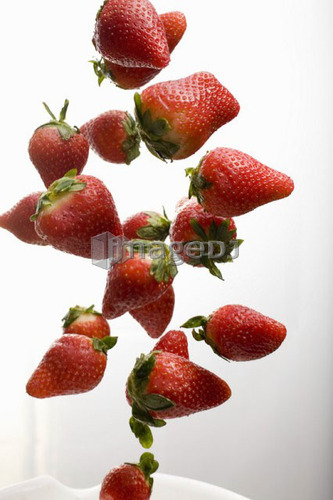 Strawberries falling