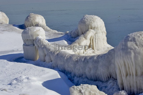 Snow and Ice covered fence along Lake Ontario, Burlington, Ontario.