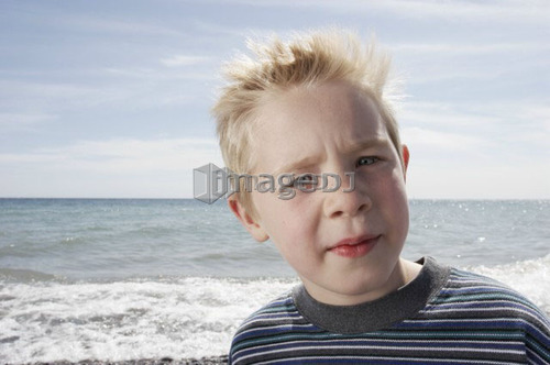 Boy on beach, Whitby, Ontario.