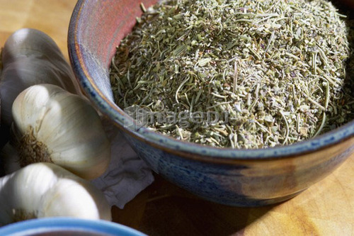 Bowl of Italian seasoning with garlic