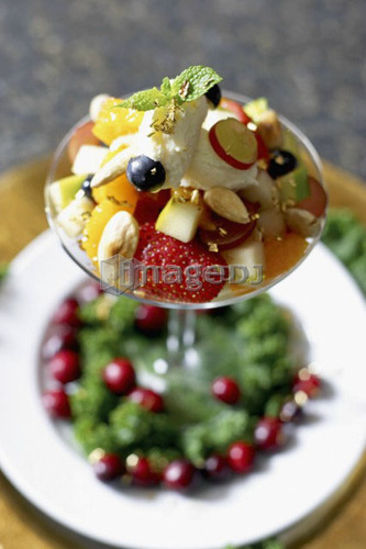 Festive fruit cocktail with mascarpone cheese in a martini glass
